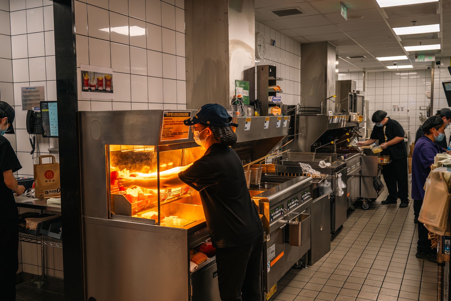 Restaurant interior with cooking area and seating